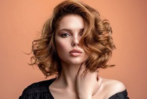 Woman with a tousled bob in a side parting